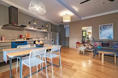 a kitchen and living room with a table and chairs at Lux clevercomfy appartmentthe center of Athens in Athens