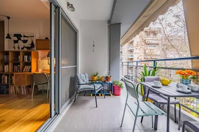 an apartment with a balcony with a table and chairs at Lux clevercomfy appartmentthe center of Athens in Athens