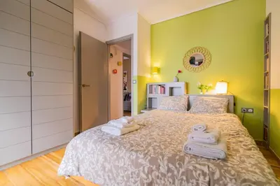 a bedroom with a bed with towels on it at Lux clevercomfy appartmentthe center of Athens in Athens