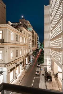 a view of a city street at night at The Marblous Athens in Athens