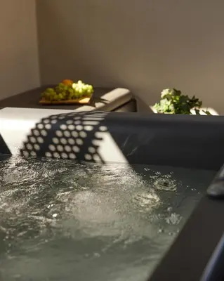 a close up of the top of a bath tub at Athens 1890 Hotel & Spa in Athens
