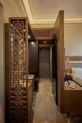 a room with a bathroom with a sink and a bed at Athens 1890 Hotel & Spa in Athens