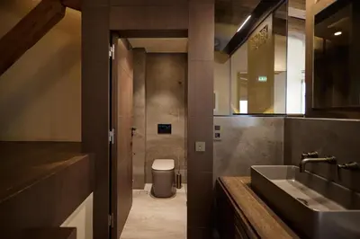 a bathroom with a sink and a toilet at Athens 1890 Hotel & Spa in Athens