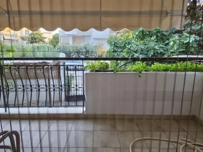 a balcony with a planter with plants on it at Family House in Glyfada center in Athens