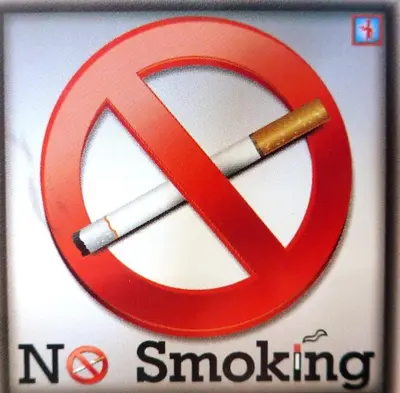 a sign with a no smoking sign with a cigarette at Family House in Glyfada center in Athens