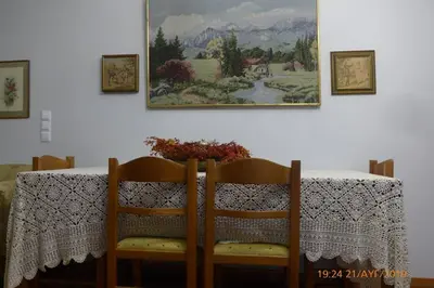 a table with two chairs and a table with a table cloth at Family House in Glyfada center in Athens