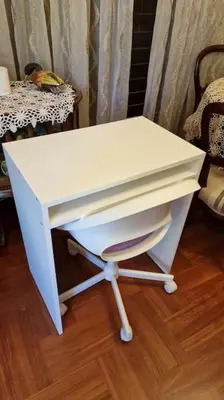 a white desk sitting on top of a wooden floor at Family House in Glyfada center in Athens