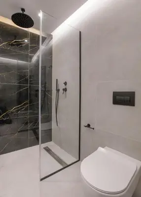 a bathroom with a shower and a toilet at Acropolis Golden Suites by GHH in Athens