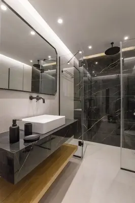 a bathroom with a sink and a shower at Acropolis Golden Suites by GHH in Athens