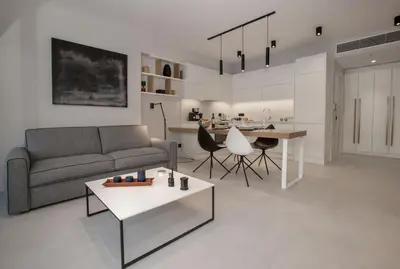 a living room with a couch and a table at Acropolis Golden Suites by GHH in Athens