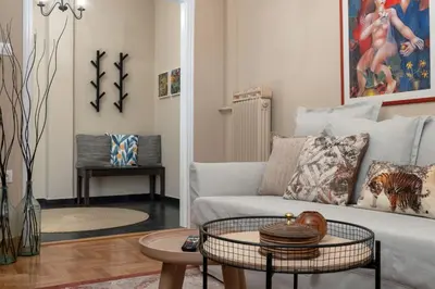 a living room with a couch and a table at Absolute Athens XI in Athens