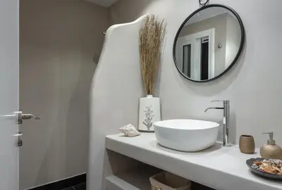 a bathroom with a sink and a mirror on a counter at Absolute Athens XI in Athens