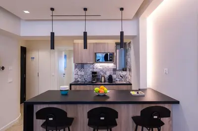 a kitchen with a island with a bowl of fruit on it at Hestia - Romvis 9 in Athens