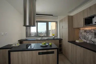 a kitchen with a sink and a window at Hestia - Romvis 9 in Athens