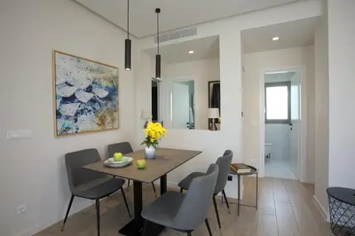 a dining room with a table and chairs at Hestia - Romvis 9 in Athens