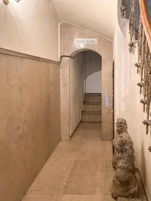 a hallway of a building with a stairway at Exclusive New Modern Apartment at Syntagma Square in Athens