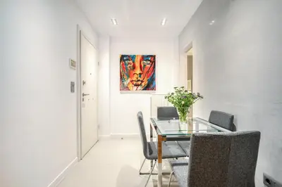 a dining room with a glass table and chairs at Elegant Light Two Bedroom Apartment in City Center in Athens