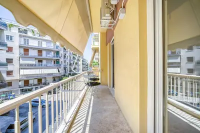 a balcony with a view of a building at Elegant Light Two Bedroom Apartment in City Center in Athens