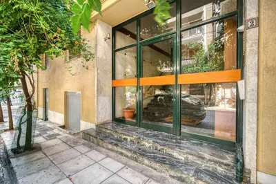 a store front window with a car in it at Elegant Light Two Bedroom Apartment in City Center in Athens