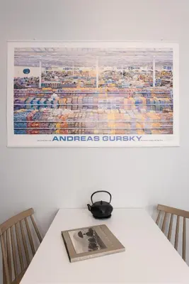 a white table with a picture on the wall at So Athens - Stylish 2 bedroom flat in Athens