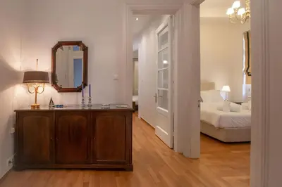 a room with a bedroom with a bed and a mirror at Neoclassical Apartment close to Syntagma-Plaka by GHH in Athens
