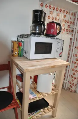 a microwave oven sitting on top of a table at Sunny Apartment with view in Athens