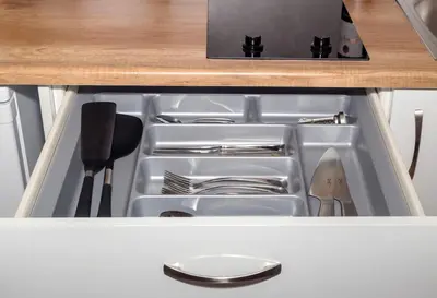 an empty drawer in a kitchen with utensils at Stylish Loft In Athens VIPGreece in Athens
