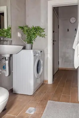 a washing machine in a bathroom with a sink at Stylish Loft In Athens VIPGreece in Athens