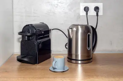 a coffee maker and a toaster on a counter at Stylish Loft In Athens VIPGreece in Athens