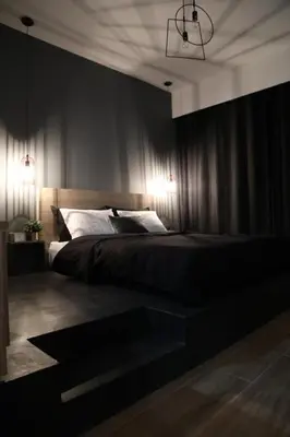 a bedroom with a large bed with black walls at Super Stylish Apartments in the Heart of Athens! in Athens