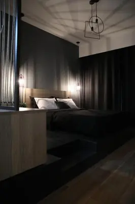 a bedroom with a bed and a black wall at Super Stylish Apartments in the Heart of Athens! in Athens