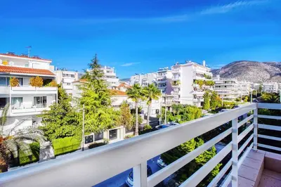 a balcony with a view of buildings at Spacious apartment in Glyfada close to the sea in Athens