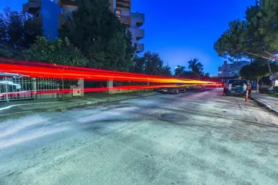 a street with red lights on the side of the road at Spacious apartment in Glyfada close to the sea in Athens