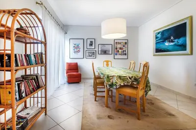 a dining room with a table and chairs at Spacious apartment in Glyfada close to the sea in Athens