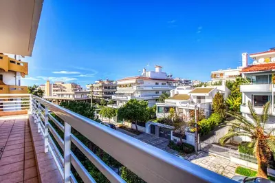 a balcony with a view of some buildings at Spacious apartment in Glyfada close to the sea in Athens