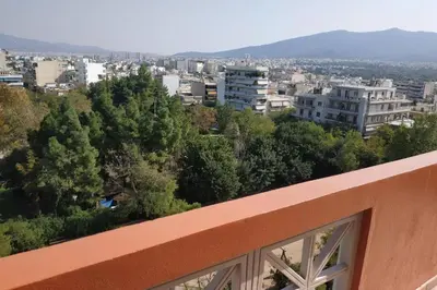 a view of a city from the balcony of a building at Psychiko's View in Athens