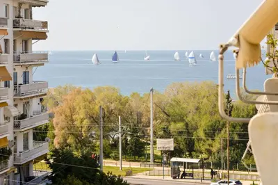 a view of the water with sailboats in the distance at Athens Sea view 2 floor apartment next to Marina in Athens