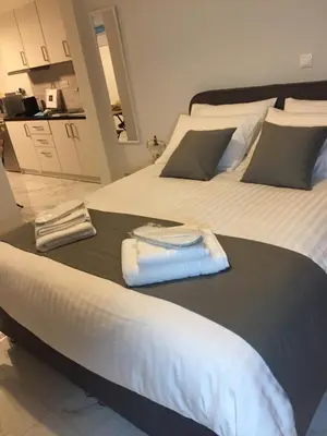 a bedroom with two beds with towels on them at V17 Syntagma Studio in Athens