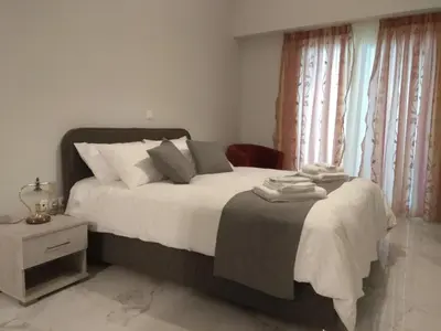a bedroom with a large bed with white sheets at V17 Syntagma Studio in Athens