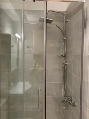 a shower with a glass door in a bathroom at V17 Syntagma Studio in Athens