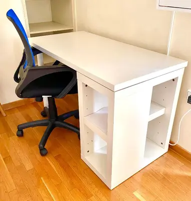 a white desk with a chair and a book shelf at Homey Penthouse in Kypseli in Athens