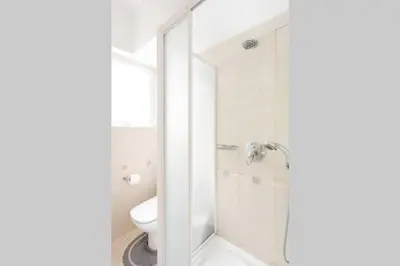 a bathroom with a shower and a toilet at Two Bedroom Apartment Near Alimos Marina ! in Athens