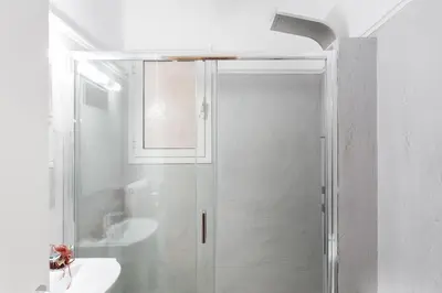 a bathroom with a shower and a sink at Syntagma 3 Bedroom Sweet Simple And Practical Apartment in Athens