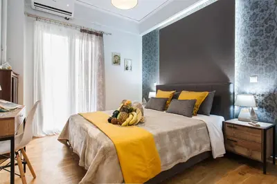 a bedroom with a large bed with bananas on it at Cozy, Central, Safe apartment close to Acropolis in Athens