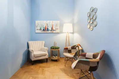 a living room with two chairs and a lamp at Cozy, Central, Safe apartment close to Acropolis in Athens