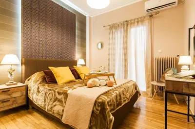 a bedroom with a bed with a table on it at Cozy, Central, Safe apartment close to Acropolis in Athens