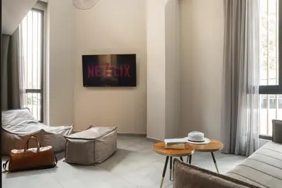 a living room with a couch and a table at 11 Enteka Acropolis Suites in Athens
