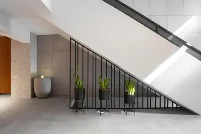 a staircase with potted plants in a room at 11 Enteka Acropolis Suites in Athens