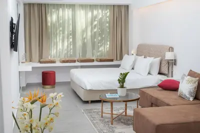 a hotel room with a bed and a couch at The Square Six in Athens