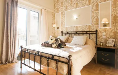 a bedroom with a bed with a stuffed dog on it at A Modern Antique Central 3 Bedroom Simple Apartment near to Acropolis in Athens
